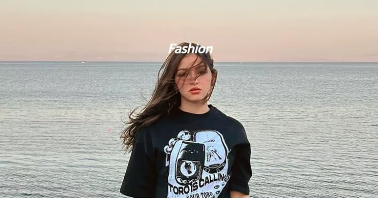 Model wearing the Toro is Calling tee by the sea
